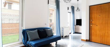 Apartment, 1 Bedroom | Living area | 30-inch TV with satellite channels