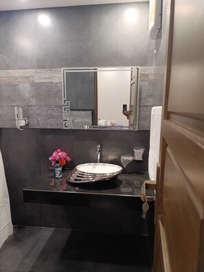 Bidet, towels, soap, toilet paper