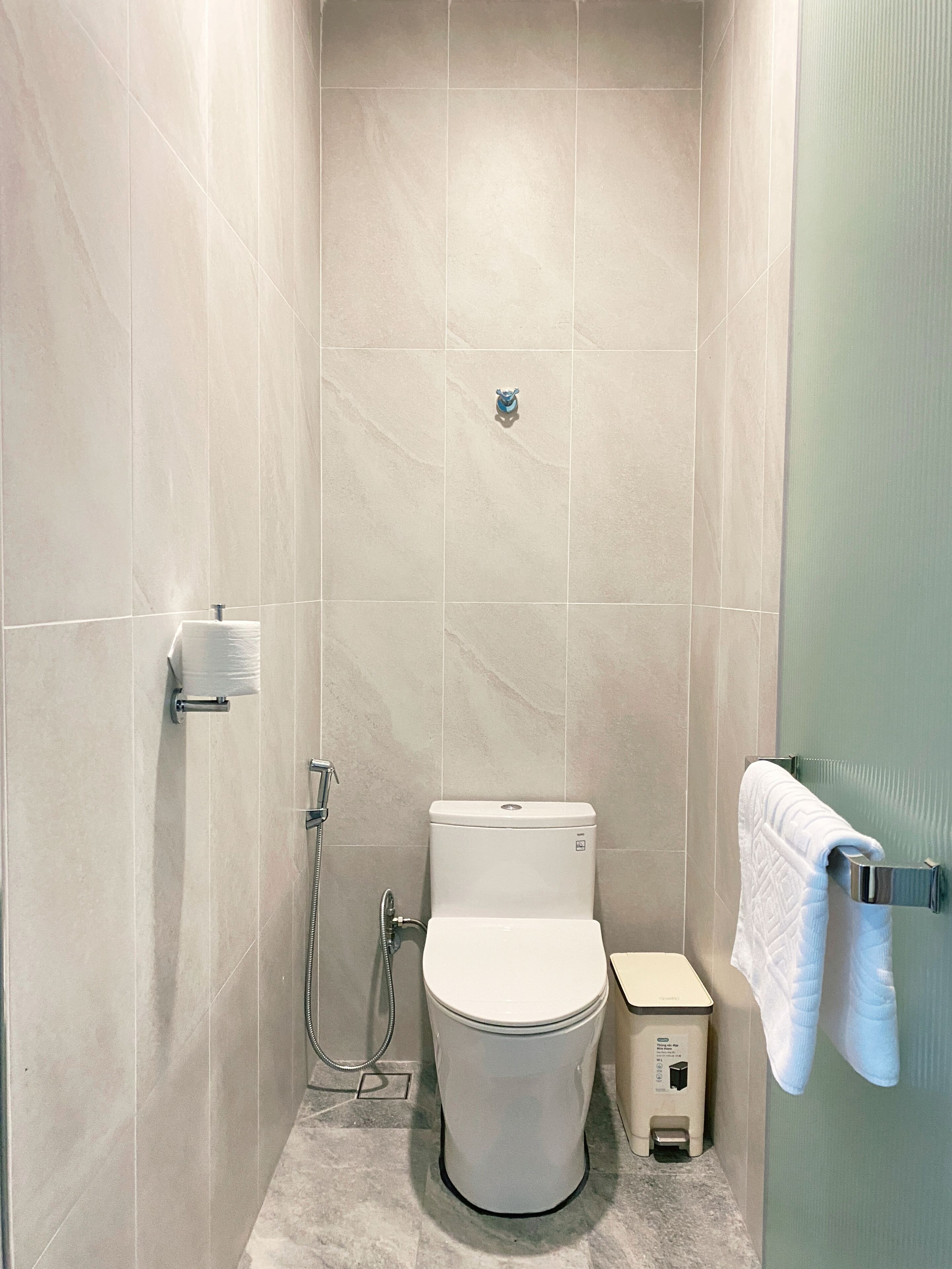 Shower, hair dryer, slippers, towels