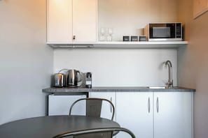 Fridge, microwave, coffee/tea maker, toaster