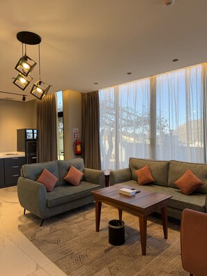 Junior Villa, 1 King Bed, Balcony, Mountain View | Living area | 42-inch Smart TV with satellite channels, fireplace