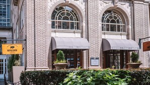 A building with two awnings advertising espresso, tea, pastries, panini, beer, and wine. - Overlooking Downtown Atlanta + Pet-friendly Stay (Atlanta)