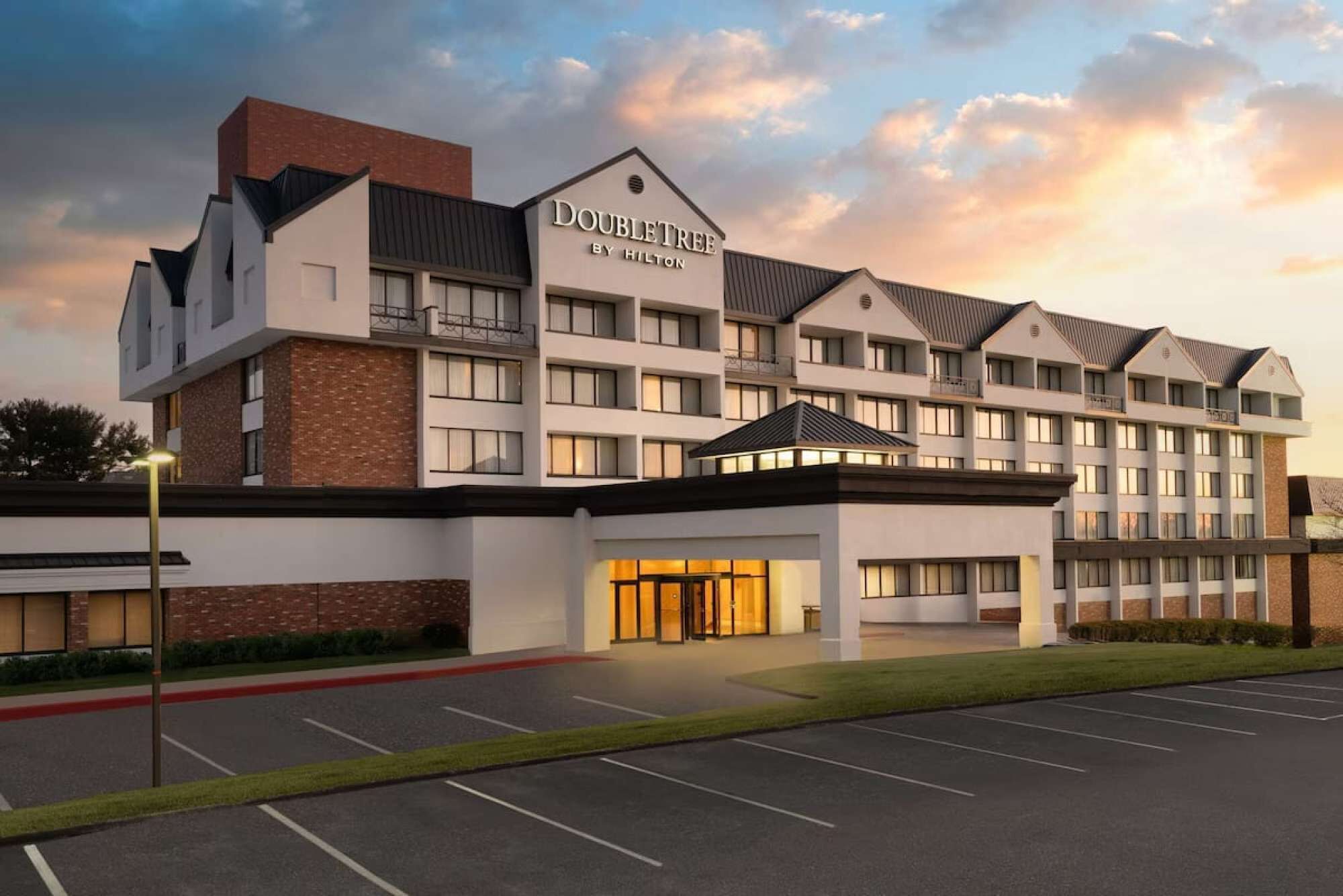 Exterior view of DoubleTree by Hilton at sunset