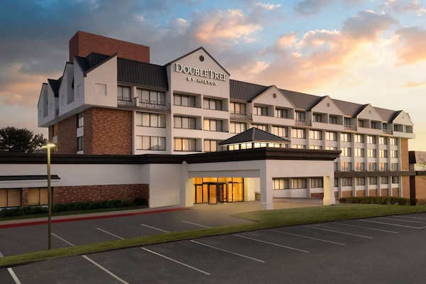 Exterior view of DoubleTree by Hilton at sunset