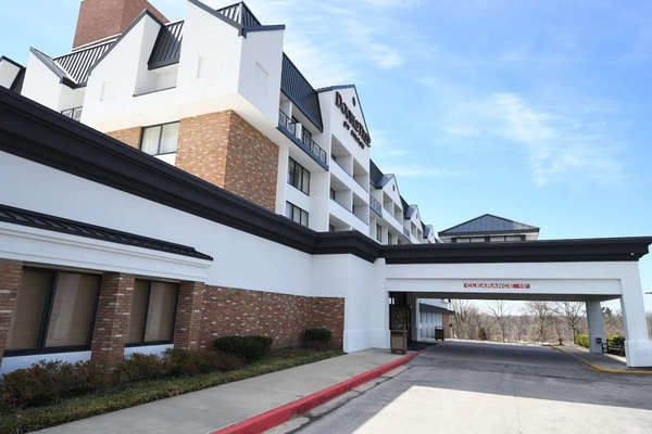 Driveway entrance with covered drop-off area