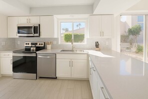 Fridge, microwave, oven, stovetop - Ironwood Resort Pet-Friendly Home with Pool & Spas (Palm Desert)