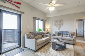 A living room with two sofas, a coffee table, and a ceiling fan. - Fun w/ Family! Sugartop Gem w/ Pool + Mtn Views (Banner Elk)