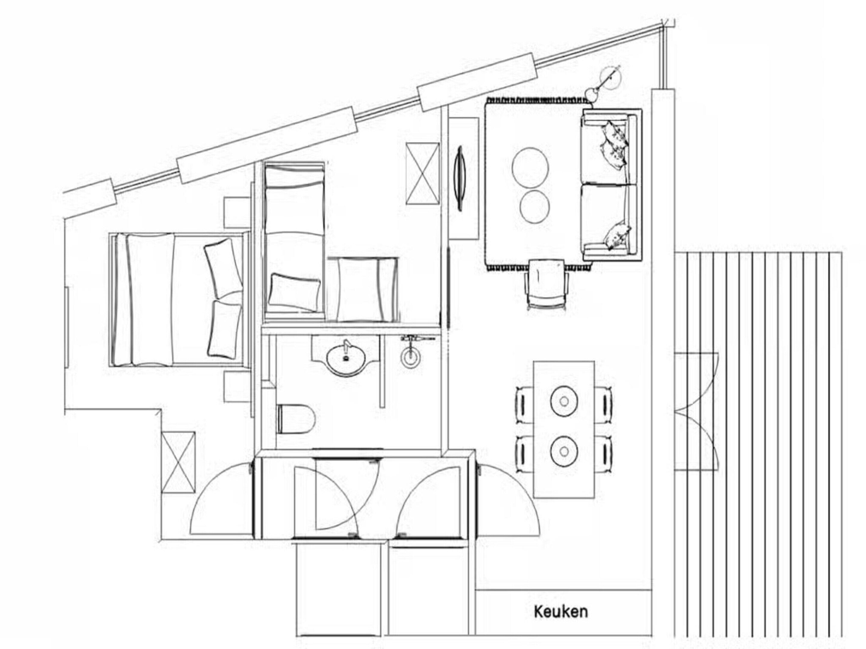 A floor plan of a house with a kitchen, dining area, and two bedrooms.