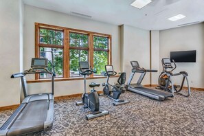 A fitness room with treadmills, stationary bikes, and elliptical machines. - Mountaineer Square 313 | 1BR Walk-to-Lifts Condo, Sleeps 4, Pool & Hot Tub (Crested Butte)