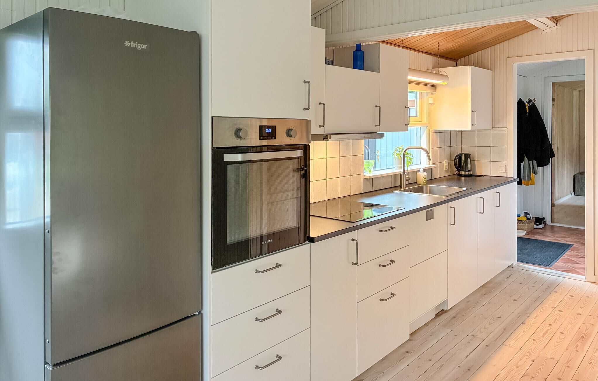 Fridge, stovetop, dishwasher, coffee/tea maker