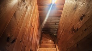 A wooden staircase with a light fixture at the top. - Lake front home in Leksand with lake view (Leksand)