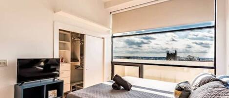 1 bedroom, desk, iron/ironing board, travel crib