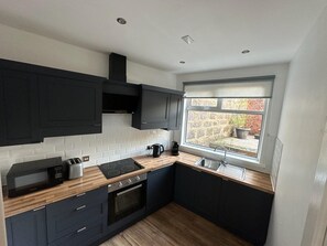 Microwave, stovetop, dishwasher, coffee/tea maker