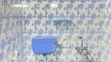 Shower, hair dryer, towels, toilet paper