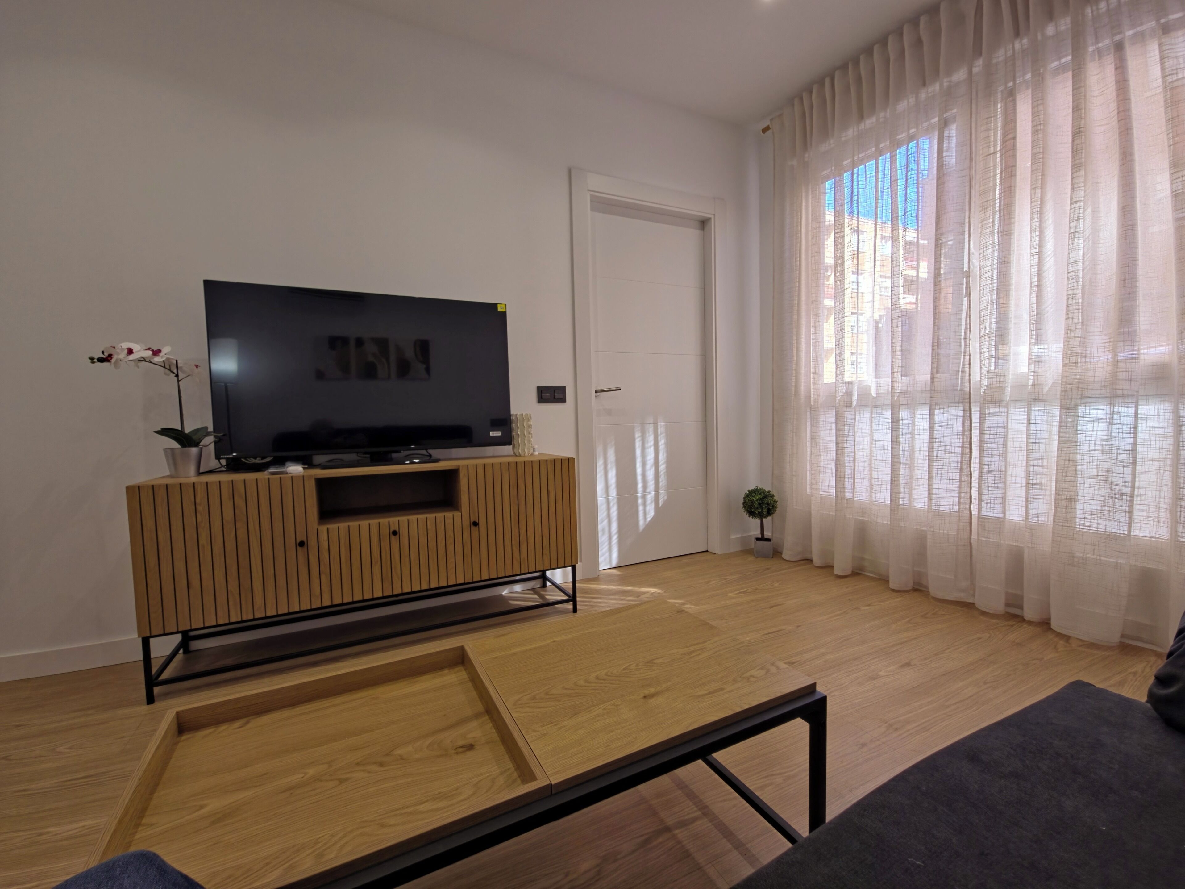 Huoneisto, 1 makuuhuone | Oleskelualue | 32–tuumainen äly-TV, jossa digitaalikanavat