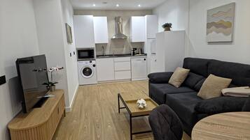 Apartment, 1 Bedroom | Living area | 32-inch Smart TV with digital channels