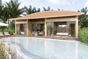 A modern resort with a swimming pool, outdoor seating, and a covered area with glass doors. - Namia River Retreat - Wellness Inclusive Resort (Hoi An)