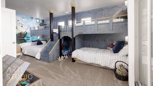 Ein Kinderzimmer mit Etagenbetten, Wandmalerei und einer Spielecke.
