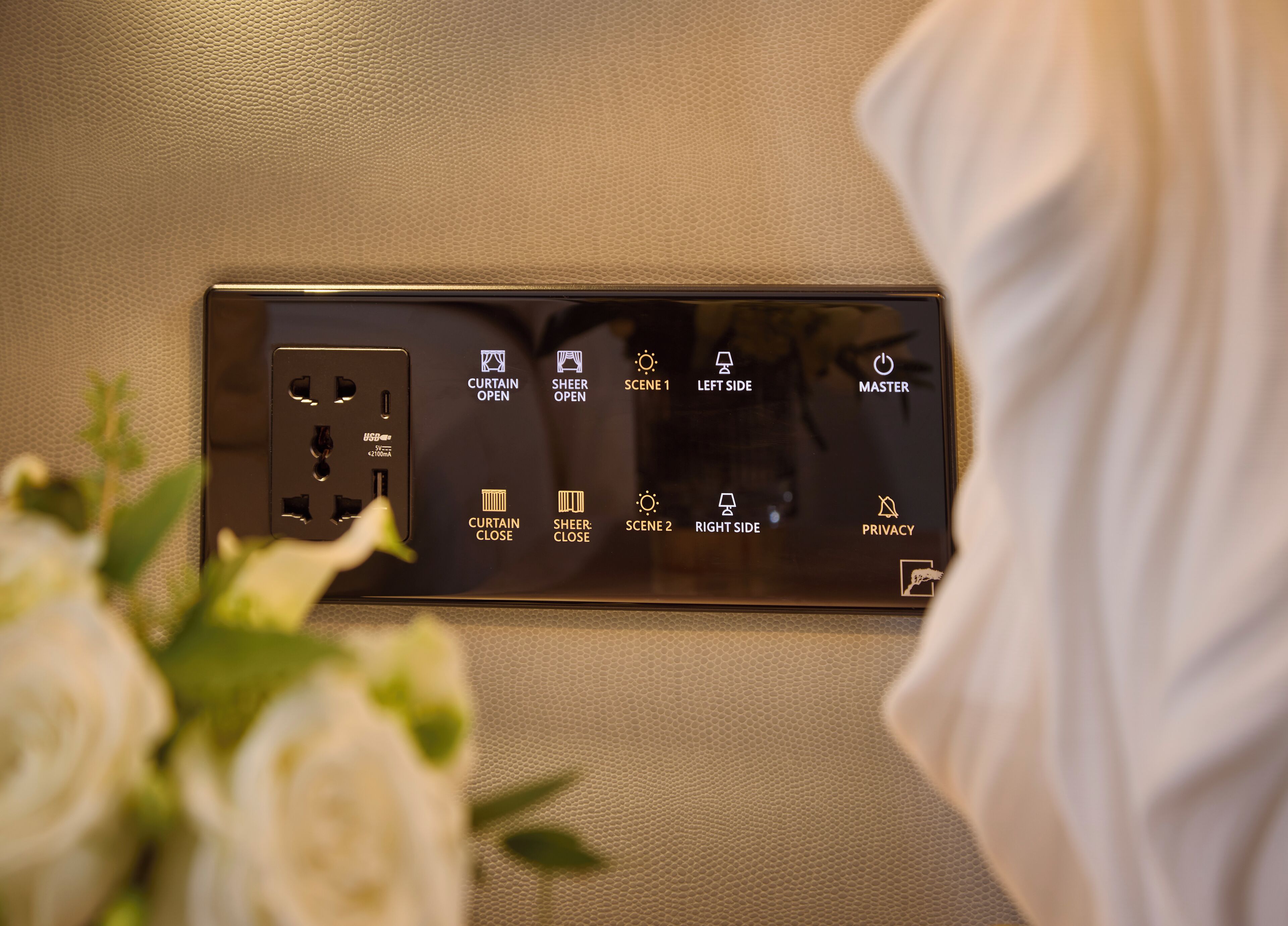 A control panel with buttons for curtain and sheer adjustments, left and right side controls, and a master switch.
