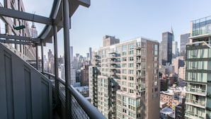A high-rise building with multiple floors, large windows, and a modern architectural design. - Bright 2 Bedrooms 2 Bathrooms Unit With Balcony (New York)