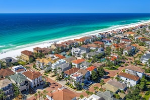 A coastal residential area with houses, a beach, and a clear blue sky. - Your Perfect Destin Vacation Starts Here - Golf Cart & Bikes (Destin)