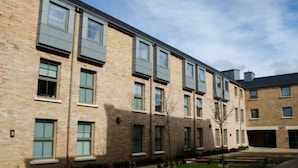 A multi-story brick building with large windows and a flat roof. - Student Only Samuel Tuke (York)