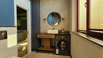 Bathtub, hair dryer, slippers, towels