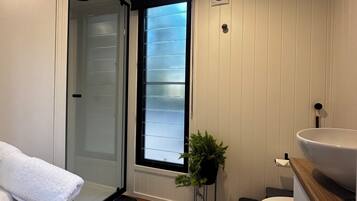 Shower, hair dryer, towels, soap