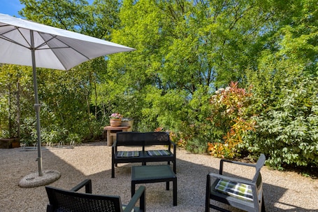 Terrace/patio. Gîte La Colline des Pins with Private Garden, Wi-Fi, and Air Conditioning