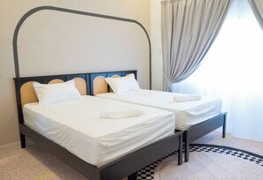 Habitación Deluxe con 1 cama matrimonial o 2 individuales | Tabla de planchar con plancha 