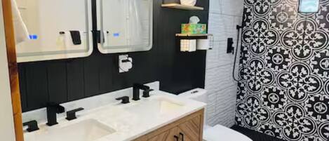 Shower, towels, soap, toilet paper