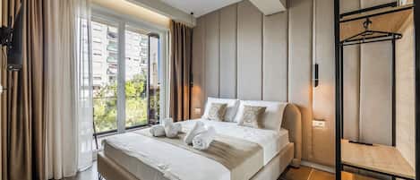 Studio Comfort - balkong - utsikt mot trädgården | Italienska Frette-lakan och sängtillbehör av högsta kvalitet