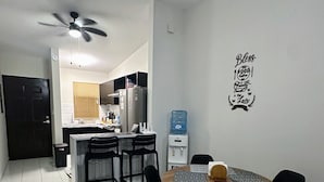 A modern kitchen with a dining area.