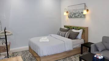 1 bedroom, desk, iron/ironing board, travel crib