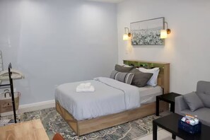 1 bedroom, desk, iron/ironing board, travel crib