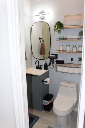 Shower, hair dryer, towels, soap