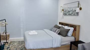 1 bedroom, desk, iron/ironing board, travel crib