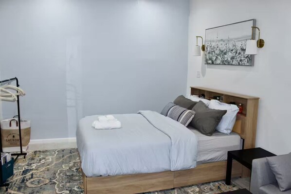 1 bedroom, desk, iron/ironing board, travel crib