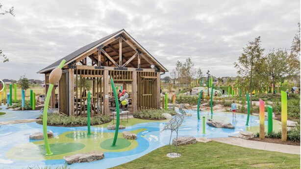 A wooden playhouse with a sloped roof and a play area with colorful ground markings and green poles. - Entire studio w/private entrance near Hwy, Playgrounds and parks (Richmond)