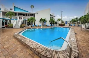 Outdoor pool, a heated pool - Beach & Marina Condo in marvelous Madeira Beach. (Madeira Beach)