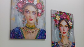 Two paintings of a woman with floral headpieces and jewelry. - Sicilia Bedda Vacation Rental (Lascari)