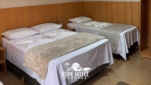 A hotel room with two beds, wooden headboard, ceiling fan, air conditioning unit, and a hanging light fixture. - Hope Hotel Pousada (Bandeirantes)