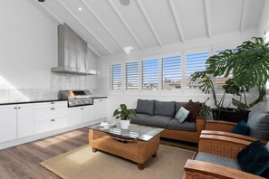 Living area - The Boat House | Custom Bar, Theatre Room, Ensuite (Mount Maunganui)