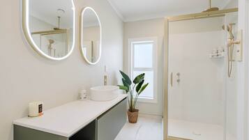 Shower, hair dryer, towels, soap