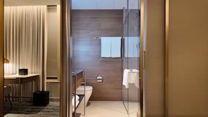 A modern bathroom with a glass shower enclosure, a toilet, and a sink. - Doubletree By Hilton Auckland Albert Street (Auckland)