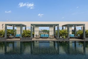 Outdoor pool, open 8:00 AM to 8:00 PM, free cabanas, sun loungers