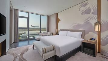 King Deluxe Suite | Down duvets, in-room safe, desk, blackout curtains