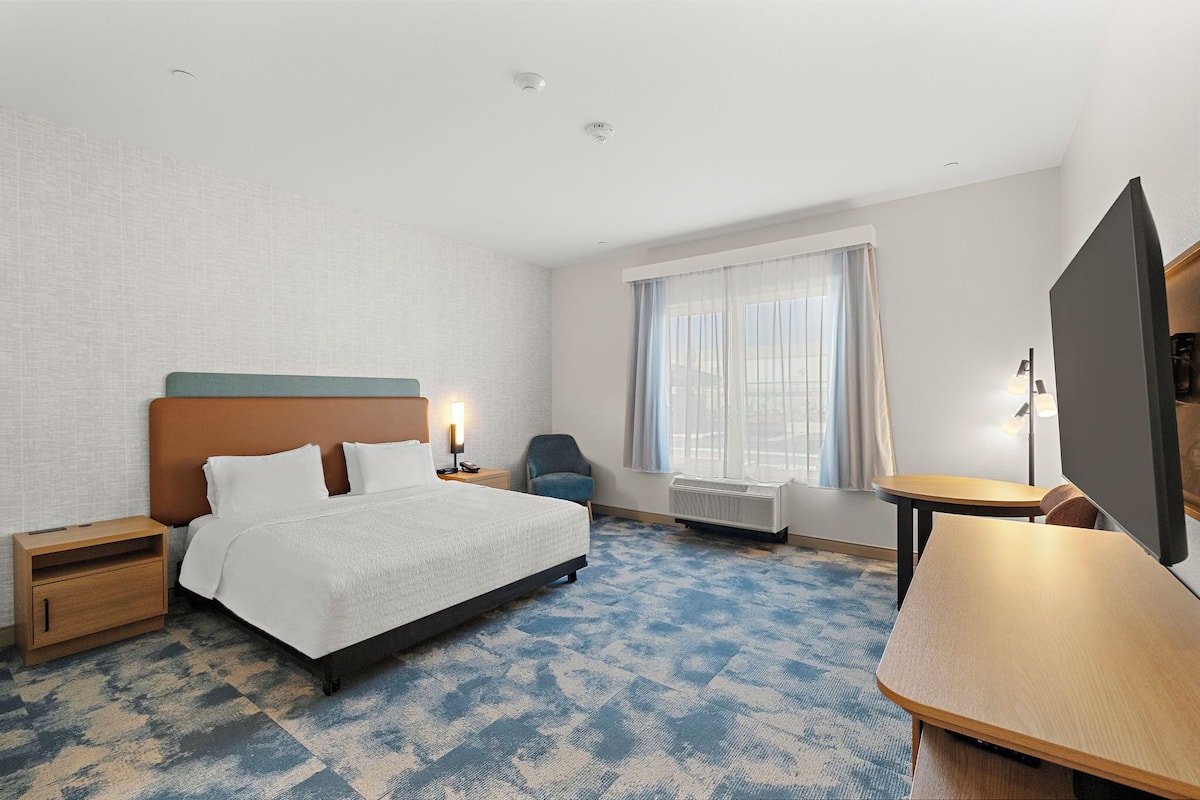 Down comforters, desk, laptop workspace, blackout drapes