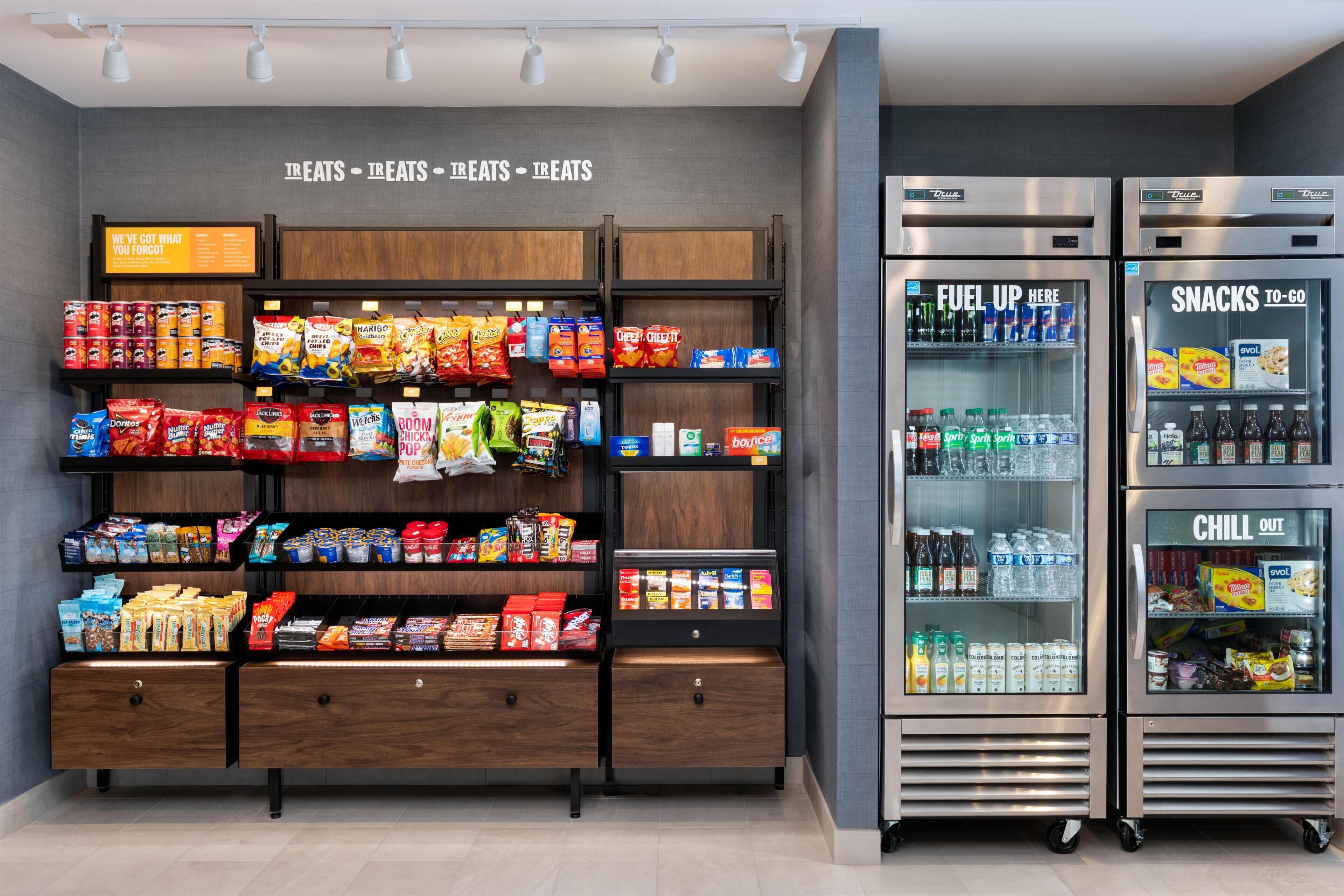 A snack and beverage vending area with various snack options and drinks.
