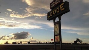 A sign for North Winds Lodge with a AAA Approved logo. - North Winds Lodge LLC (Bowman)
